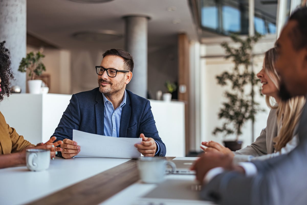 A diverse team engages in a productive business meeting in a modern office
