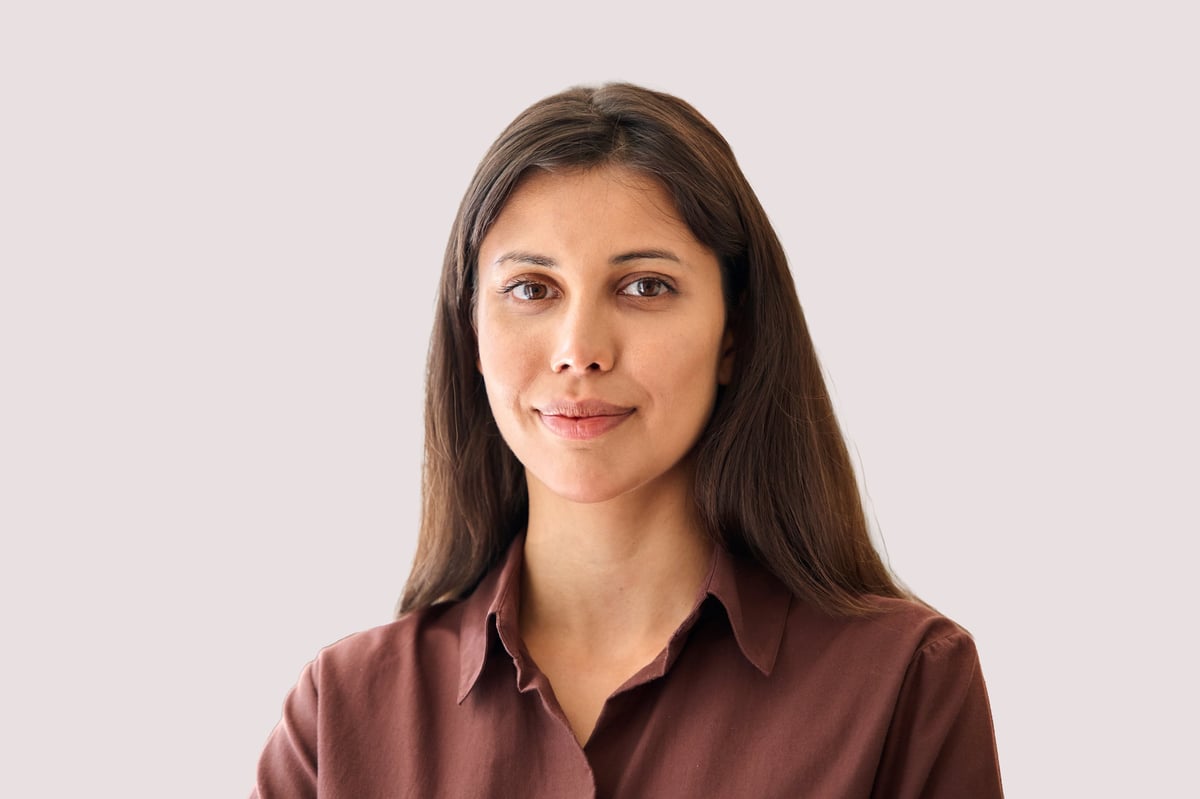 Headshot closeup portrait middle eastern or latin businesswoman smiling
